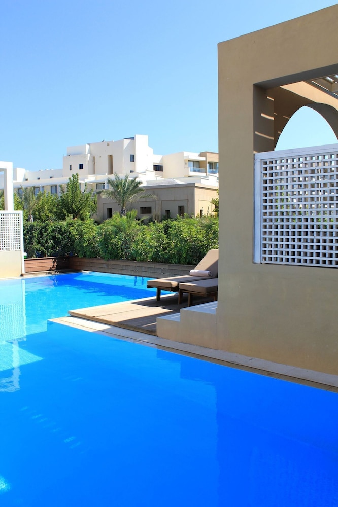 The Ixian Grand & All Suites - Adults Only — Swimming pool in Ialyssos, South Aegean