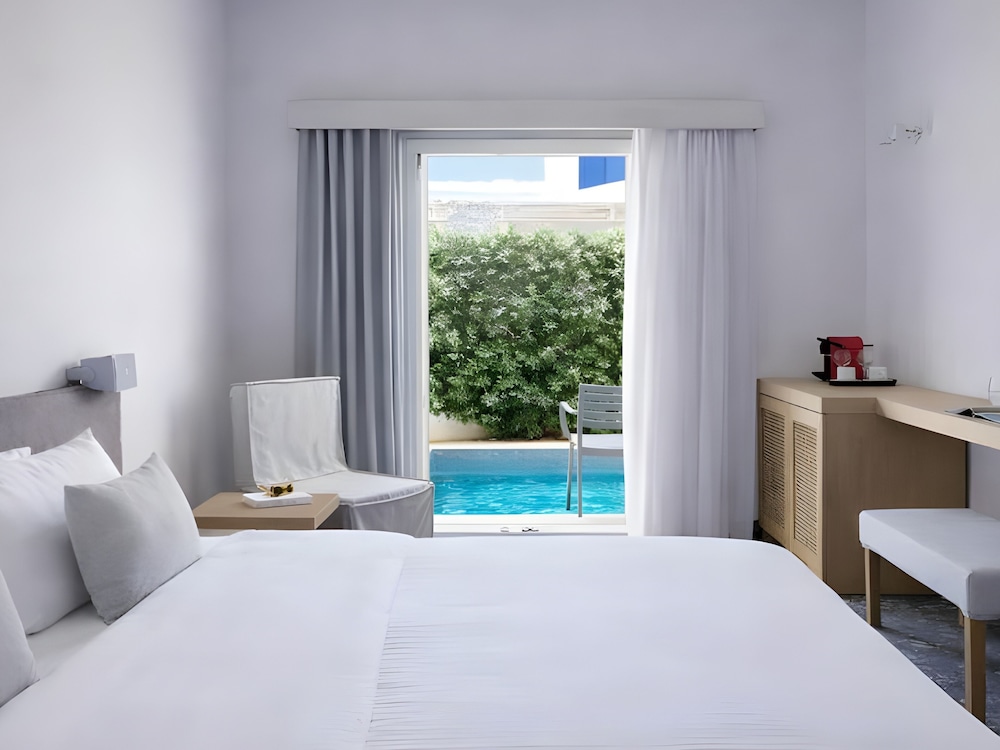 Kosmoplaz Beach Hotel — Hotel rooms in Plati Gialos, South Aegean