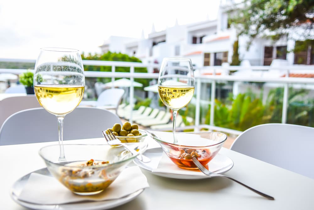 Aparthotel Nelva Resort — Restaurant & bars in Cala'n Porter, Balearic Islands