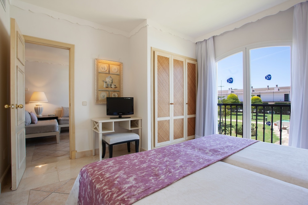 Grupotel Macarella Suites & Spa — Hotel rooms in Cala'n Bosch, Balearic Islands