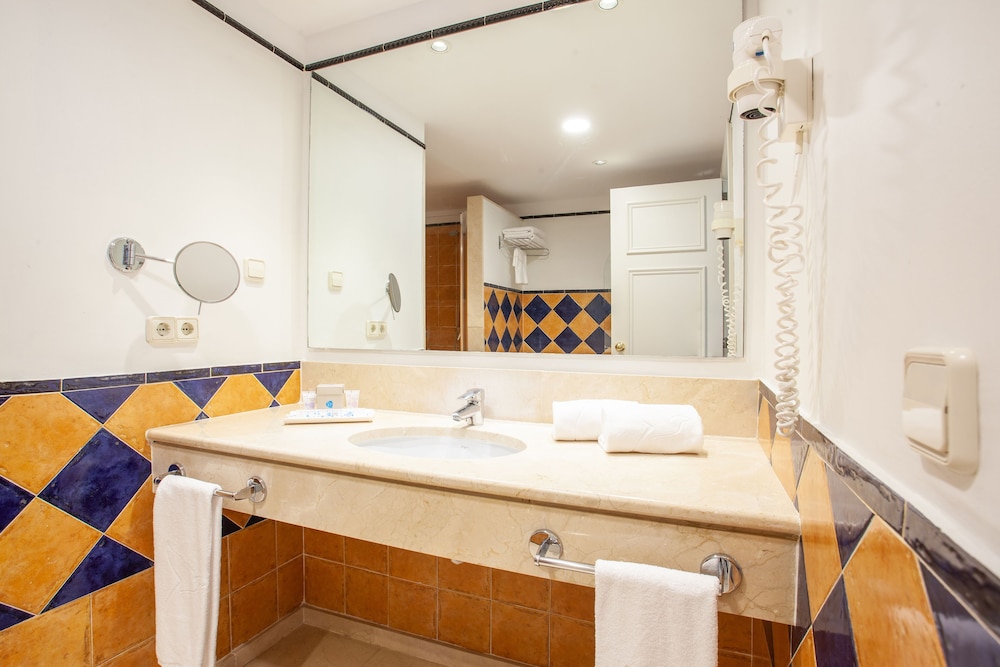 Grupotel Macarella Suites & Spa — Hotel rooms in Cala'n Bosch, Balearic Islands