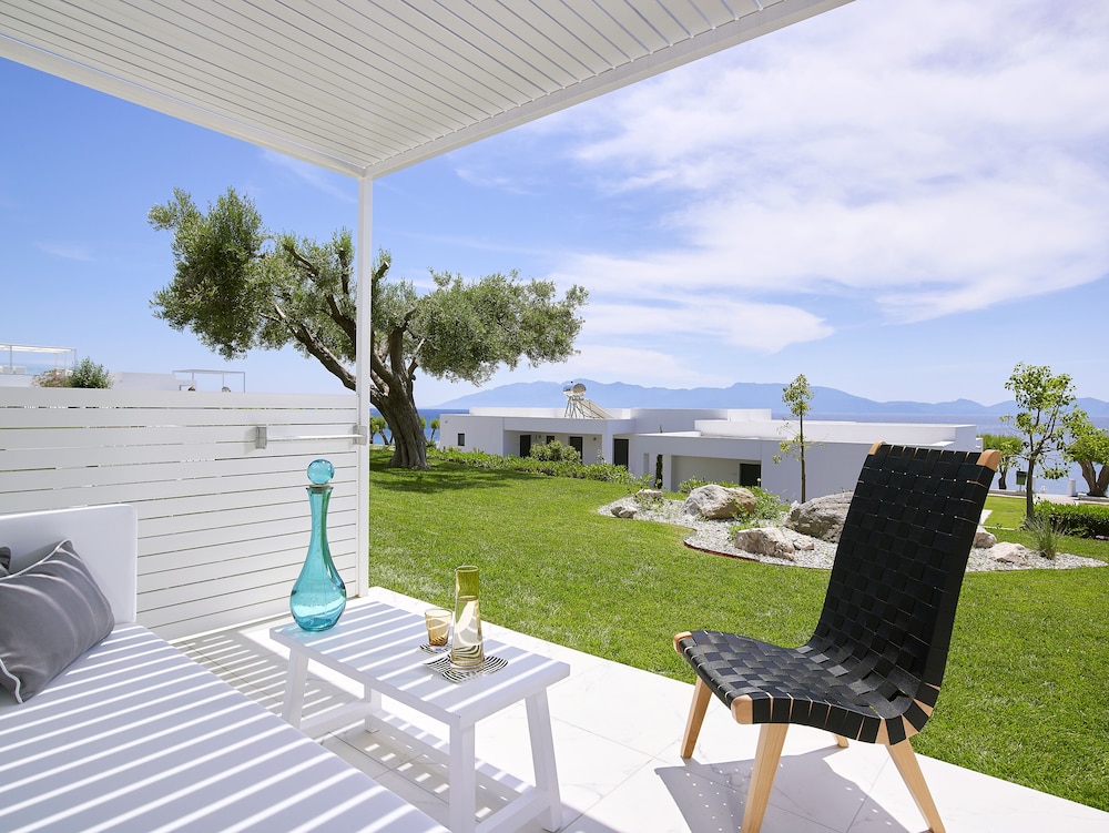 Dimitra Beach Hotel & Suites — Beach in Psalidi, South Aegean