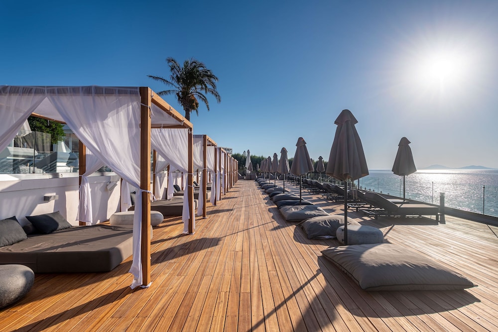 Dimitra Beach Hotel & Suites — Beach in Psalidi, South Aegean