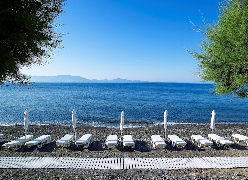 Dimitra Beach Hotel & Suites — Beach in Psalidi, South Aegean