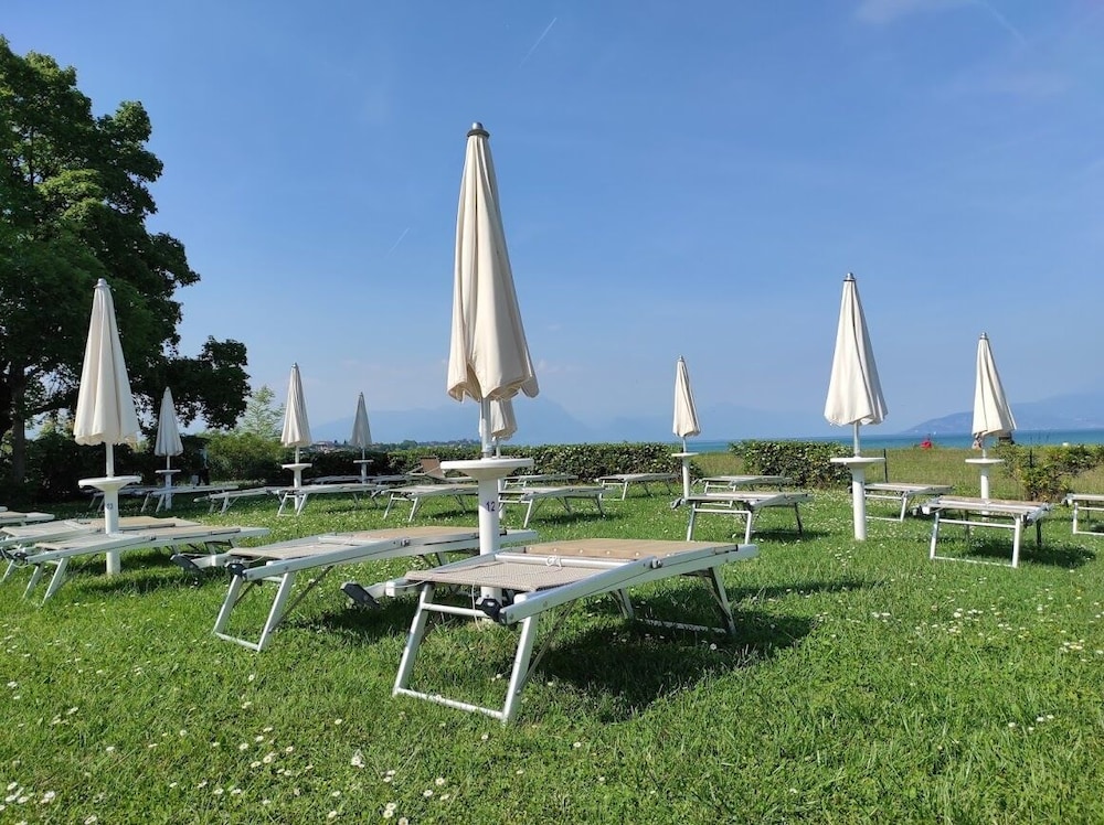 Yachting Hotel Mistral — Beach in Sirmione, Lombardy