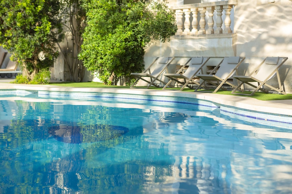 Es Baulo Petit Hotel — Swimming pool in Can Picafort, Balearic Islands