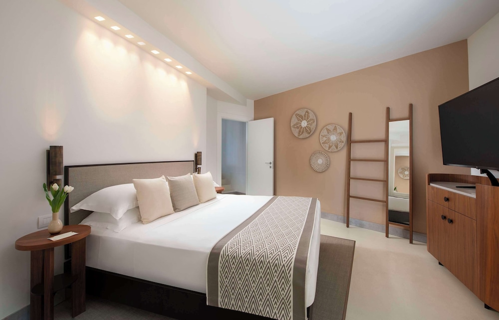 Baia di Chia Resort Sardinia, Curio Collection by Hilton — Hotel rooms in Domus de Maria, Sardinia
