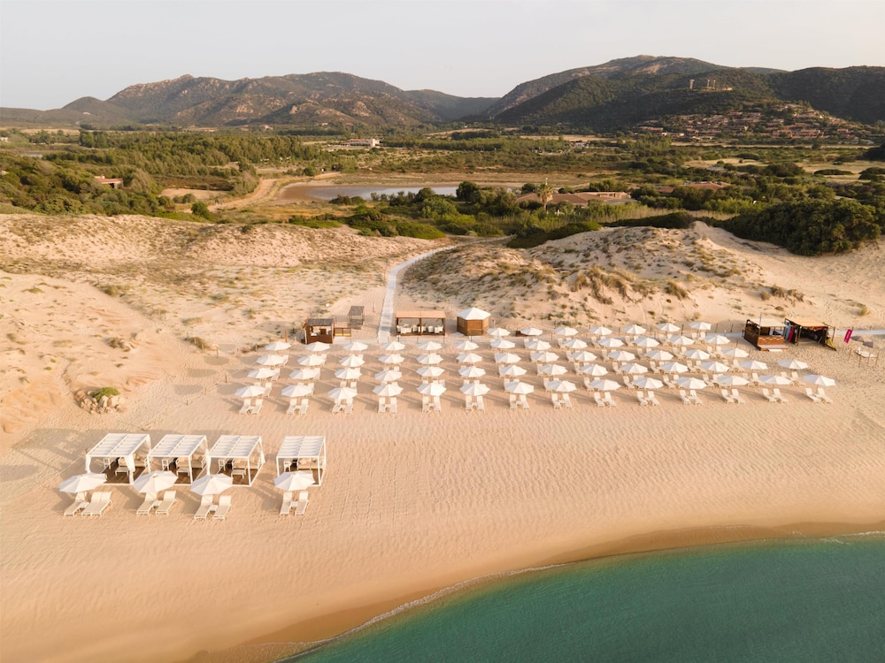 Baia di Chia Resort Sardinia, Curio Collection by Hilton — Beach in Domus de Maria, Sardinia