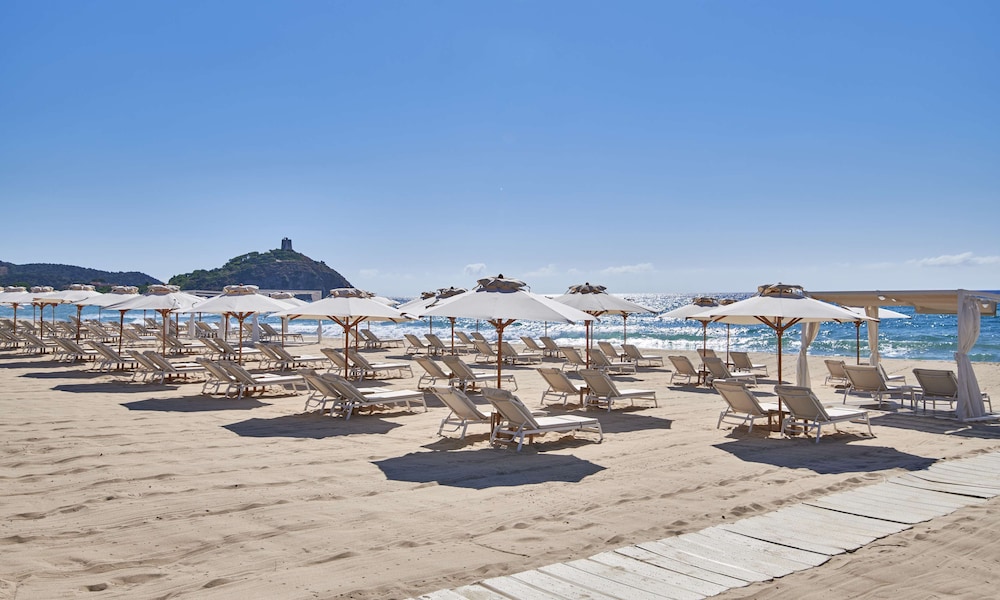 Baia di Chia Resort Sardinia, Curio Collection by Hilton — Beach in Domus de Maria, Sardinia