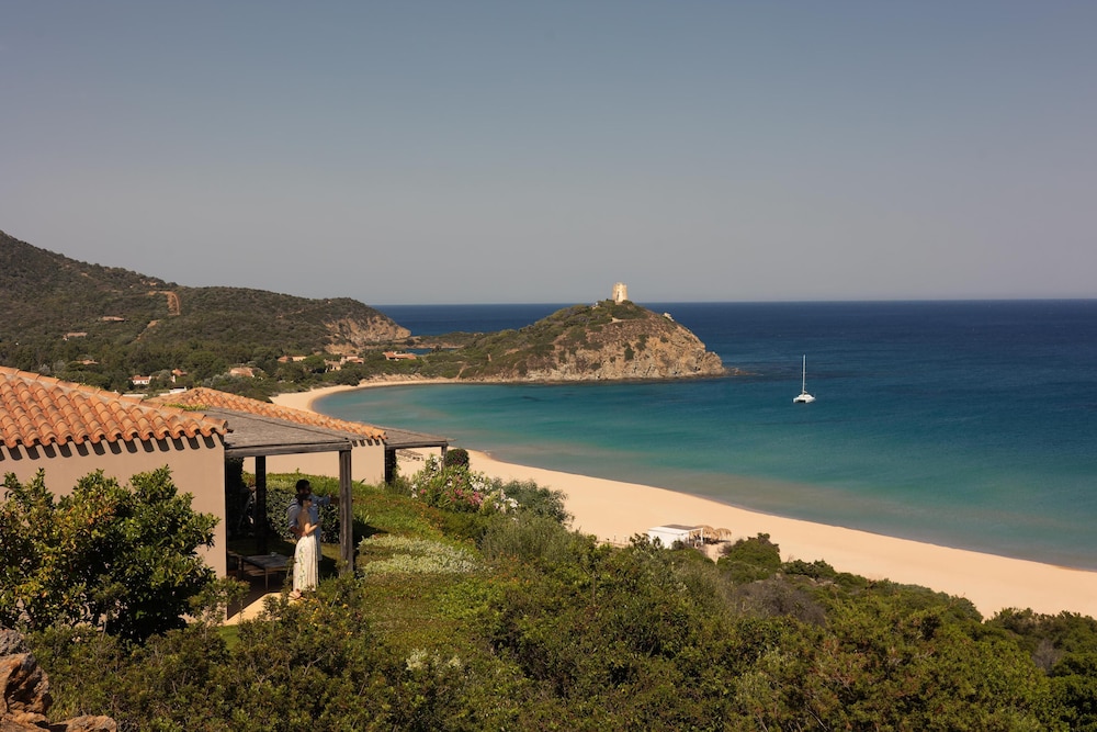 Baia di Chia Resort Sardinia, Curio Collection by Hilton — Beach in Domus de Maria, Sardinia