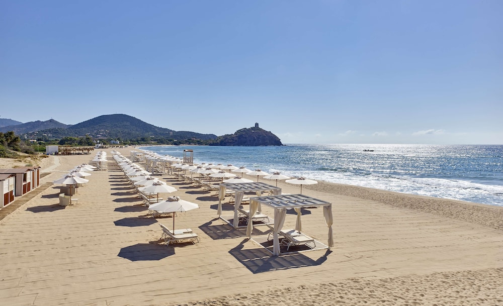 Baia di Chia Resort Sardinia, Curio Collection by Hilton — Beach in Domus de Maria, Sardinia