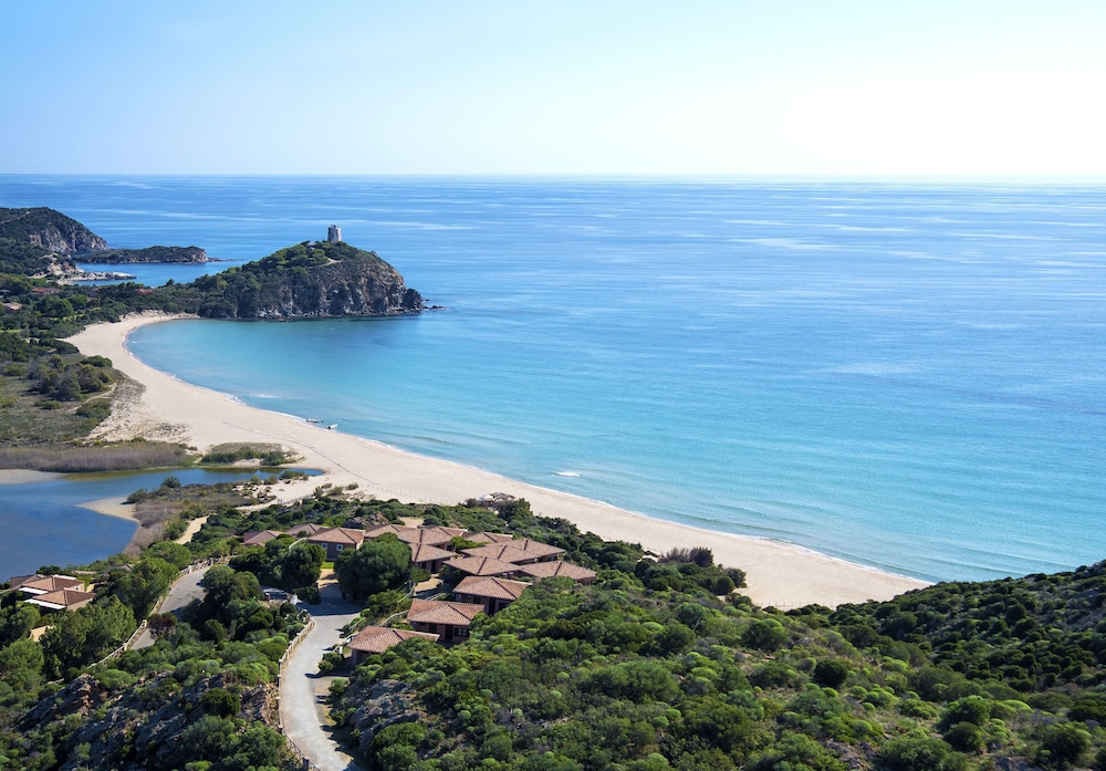 Baia di Chia Resort Sardinia, Curio Collection by Hilton — Beach in Domus de Maria, Sardinia