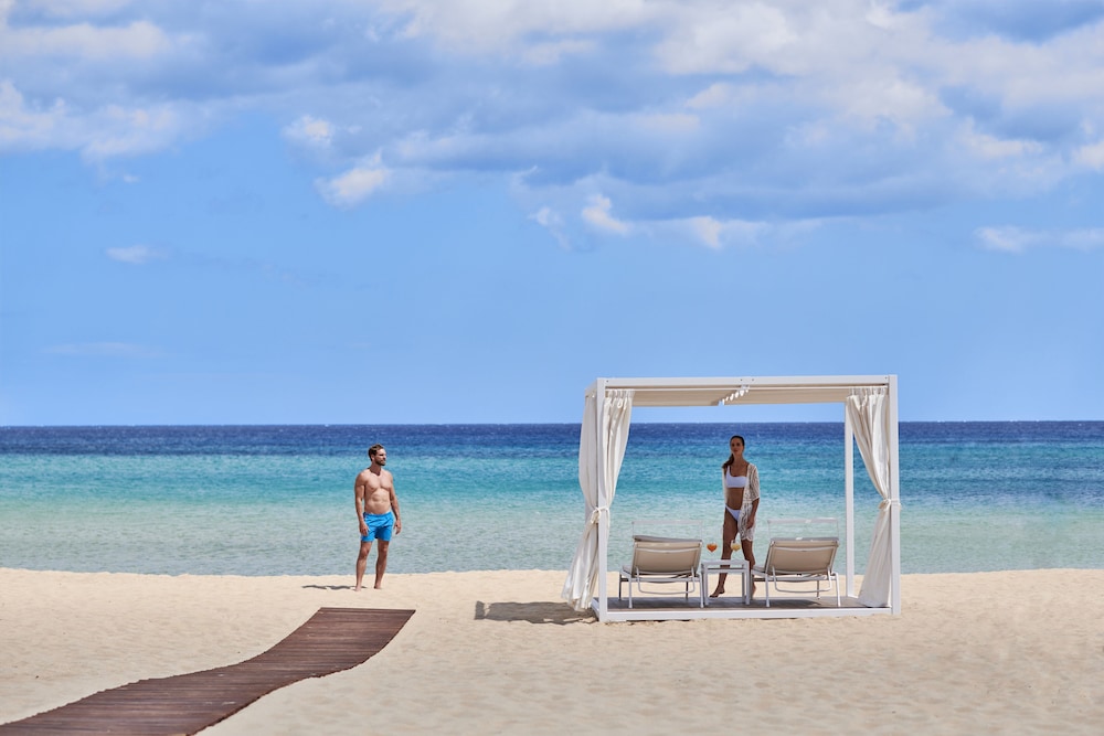 Baia di Chia Resort Sardinia, Curio Collection by Hilton — Beach in Domus de Maria, Sardinia