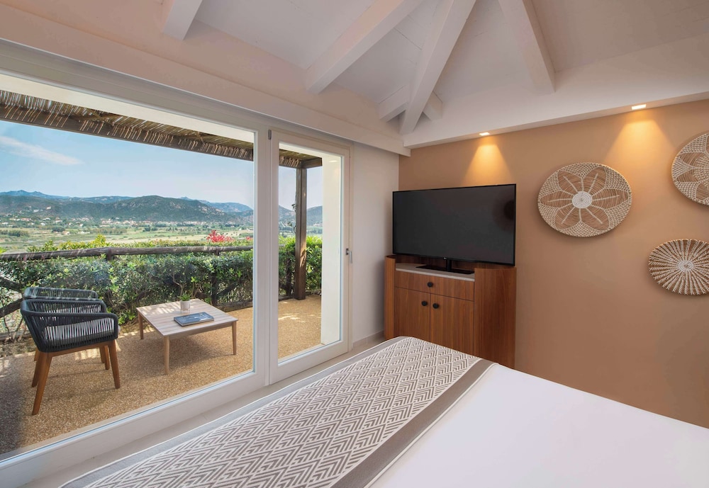 Baia di Chia Resort Sardinia, Curio Collection by Hilton — Hotel rooms in Domus de Maria, Sardinia