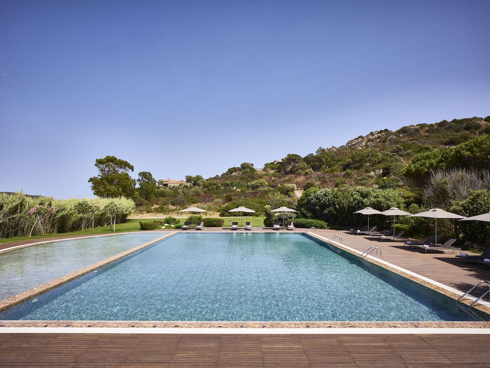 Baia di Chia Resort Sardinia, Curio Collection by Hilton — Swimming pool in Domus de Maria, Sardinia