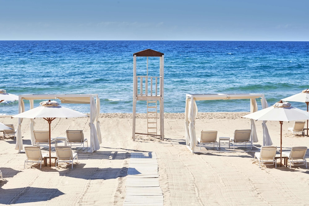 Baia di Chia Resort Sardinia, Curio Collection by Hilton — Beach in Domus de Maria, Sardinia