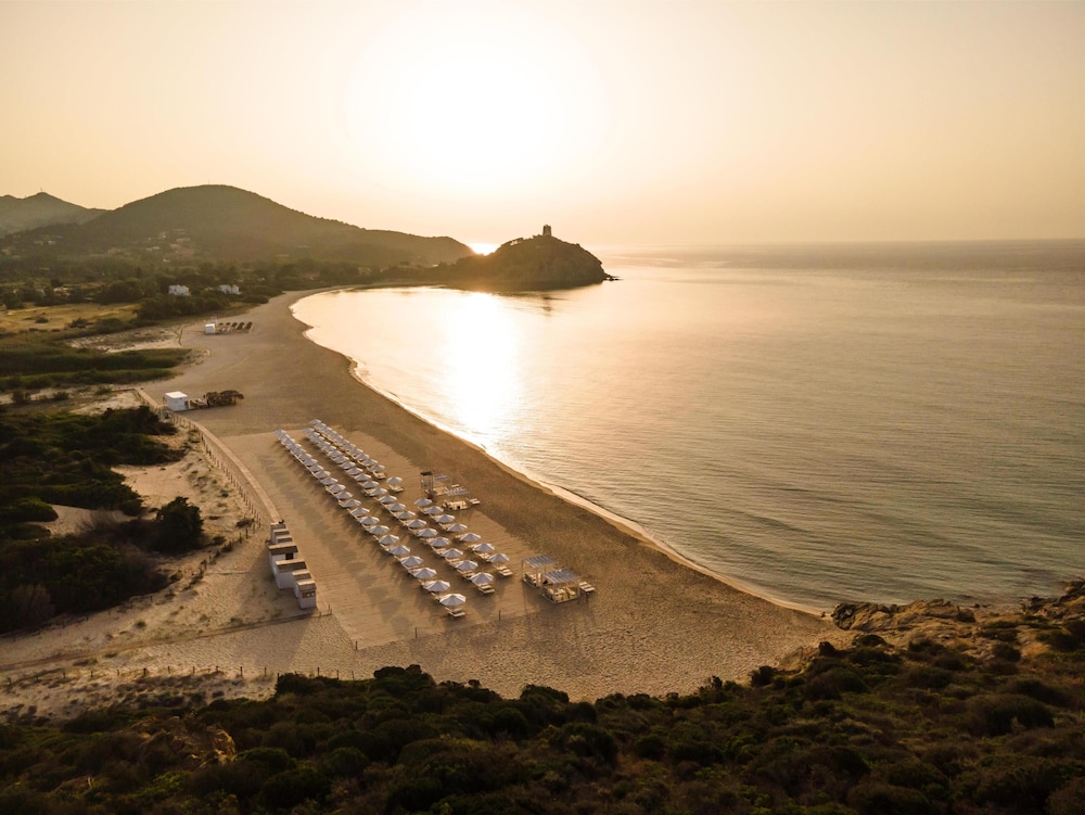 Baia di Chia Resort Sardinia, Curio Collection by Hilton — Beach in Domus de Maria, Sardinia