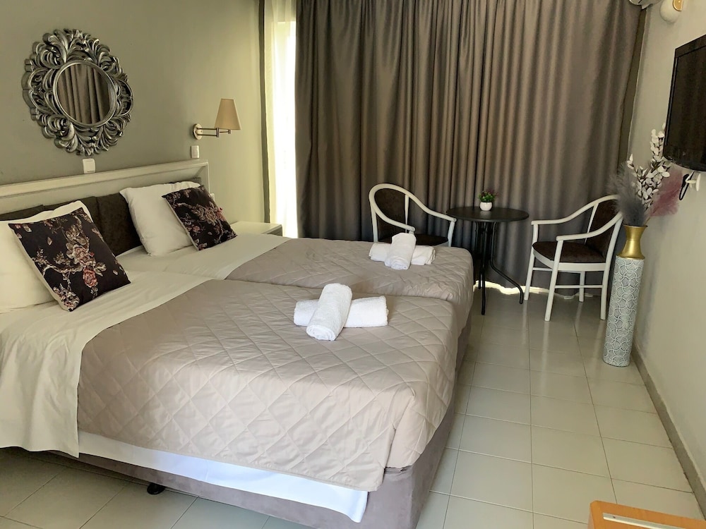 Alkyonides Hotel — Hotel rooms in Kremasti, South Aegean
