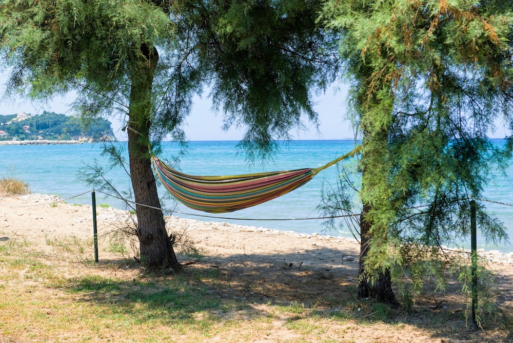 S&C Kosmos Beach Resort — Beach in Roda, Ionian Islands