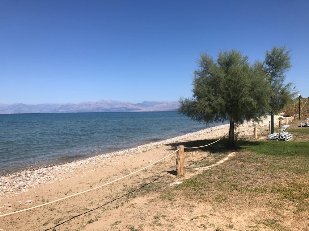 S&C Kosmos Beach Resort — Beach in Roda, Ionian Islands