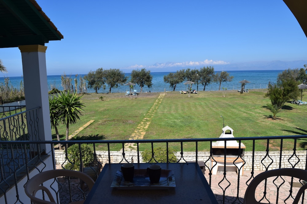 S&C Kosmos Beach Resort — Beach in Roda, Ionian Islands