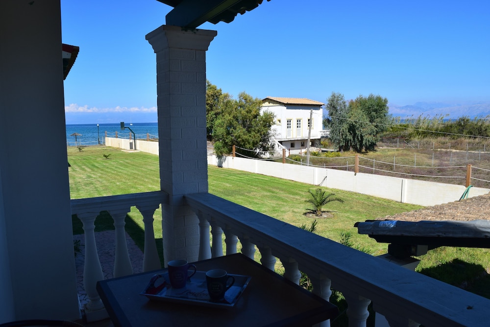 S&C Kosmos Beach Resort — Beach in Roda, Ionian Islands