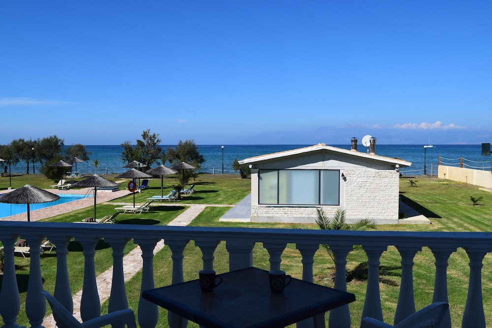 S&C Kosmos Beach Resort — Beach in Roda, Ionian Islands