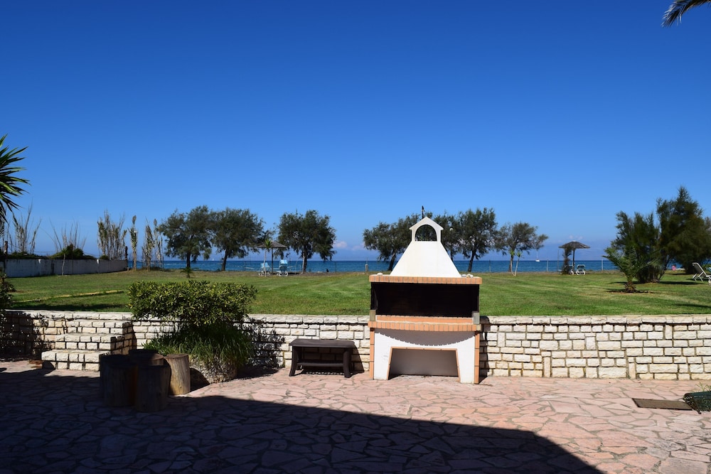 S&C Kosmos Beach Resort — Beach in Roda, Ionian Islands