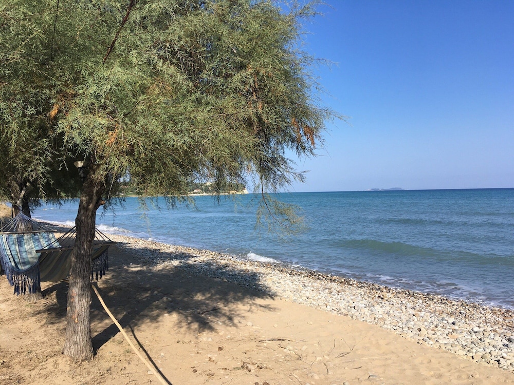 S&C Kosmos Beach Resort — Beach in Roda, Ionian Islands