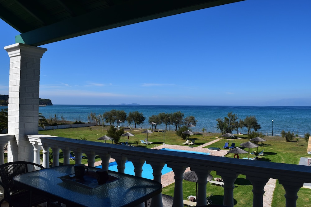 S&C Kosmos Beach Resort — Beach in Roda, Ionian Islands