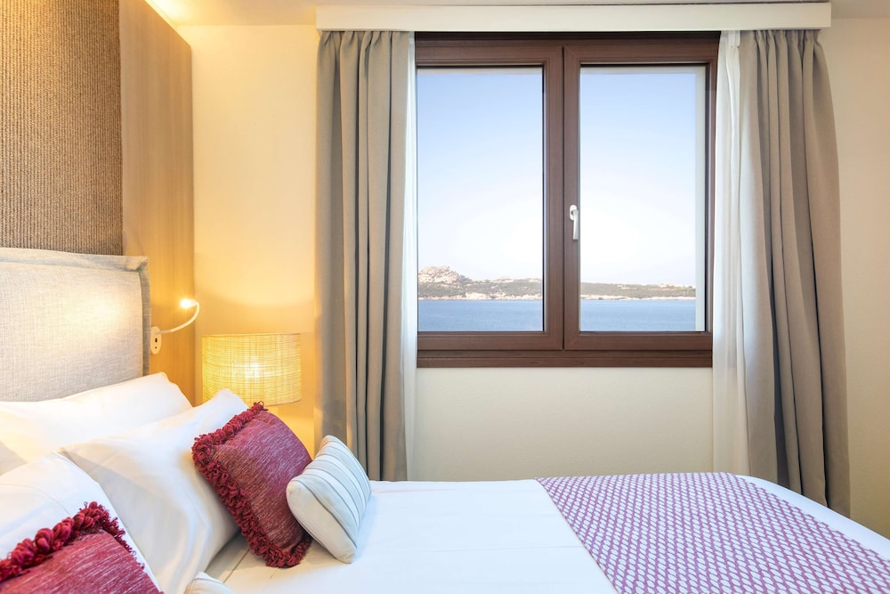 Mangia's Santa Teresa Sardinia, Curio Collection by Hilton — Hotel rooms in Capo Testa, Sardinia