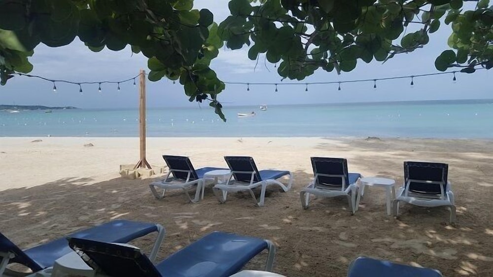 Firefly Beach Cottages and Suites — Beach in Negril
