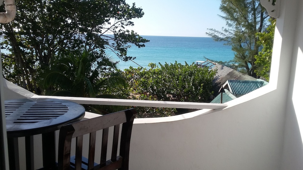 Firefly Beach Cottages and Suites — Beach in Negril