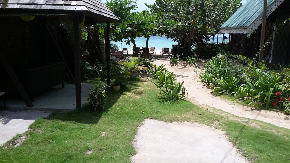 Firefly Beach Cottages and Suites — Beach in Negril