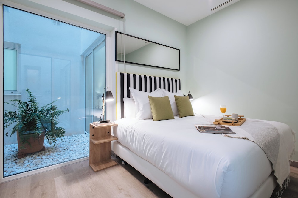 Sercotel Sevilla Guadalquivir Suites — Hotel rooms in Seville, Andalusia