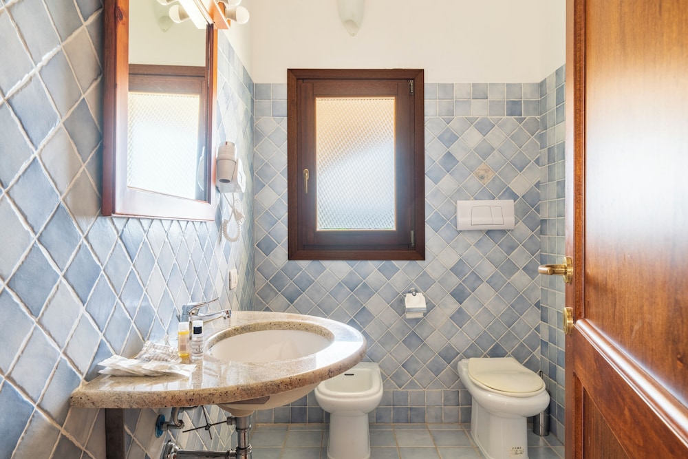Residence Baia Santa Reparata — Hotel rooms in Capo Testa, Sardinia