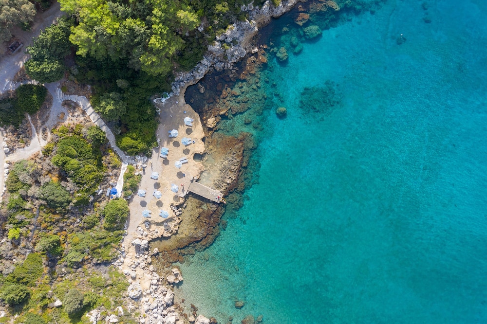 Kouros Exclusive Suites - Adults Only — Beach in Faliraki, South Aegean
