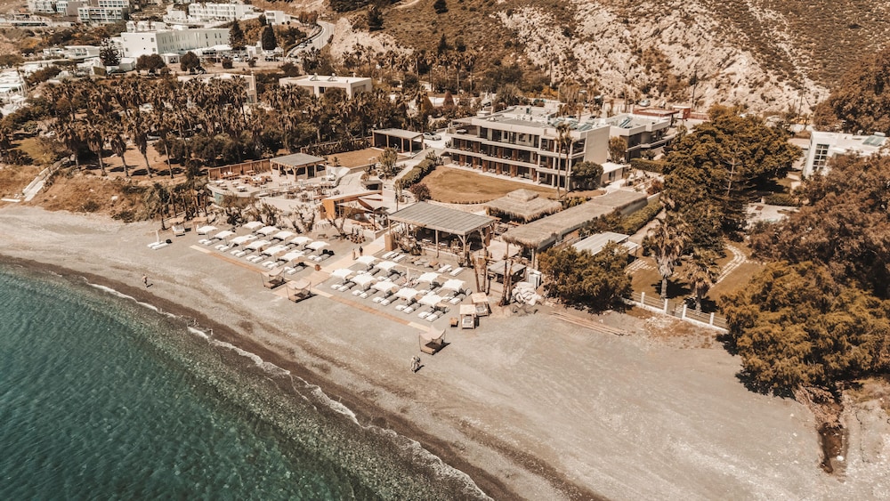 Sagredo Beachfront Retreat & Spa by E-GEO — Beach in Psalidi, South Aegean