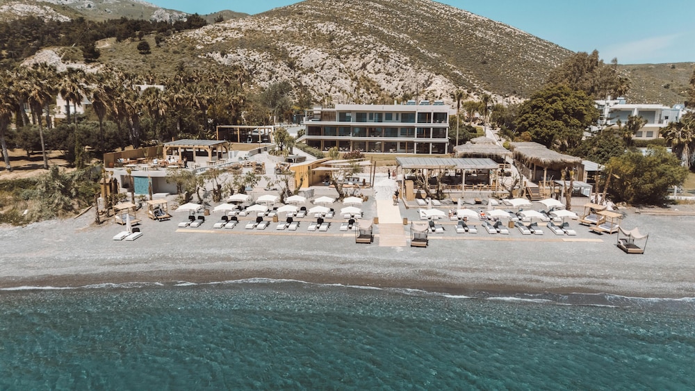 Sagredo Beachfront Retreat & Spa by E-GEO — Beach in Psalidi, South Aegean