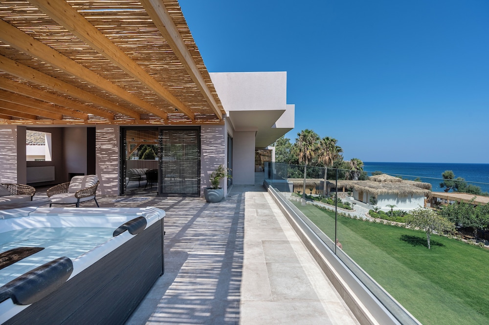 Sagredo Beachfront Retreat & Spa by E-GEO — Hotel building in Psalidi, South Aegean