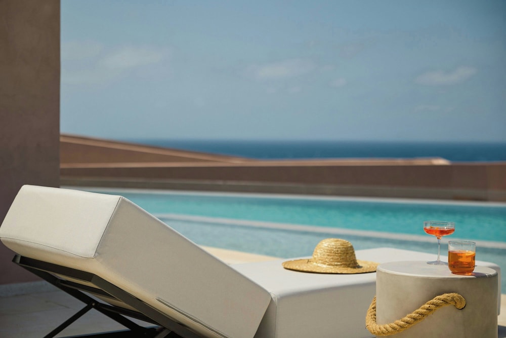 Domes Novos Santorini, Autograph Collection — Swimming pool in Oia, South Aegean