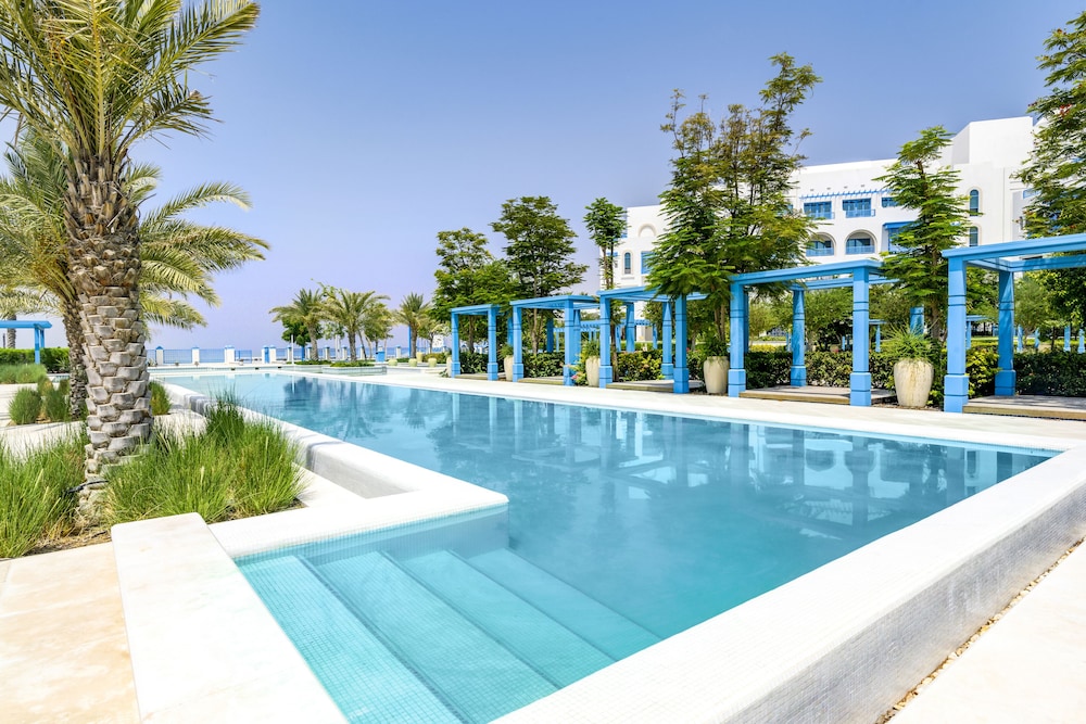 Hilton Salwa Beach Resort & Villas — Swimming pool in Abu Samra