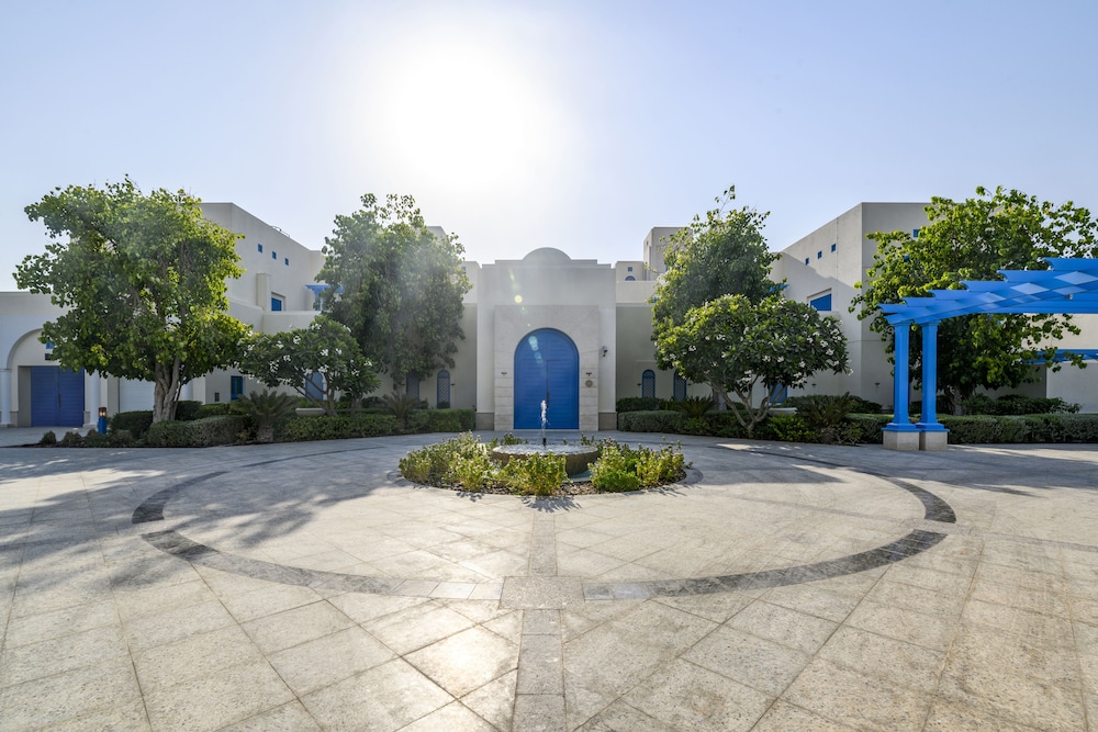 Hilton Salwa Beach Resort & Villas — Hotel building in Abu Samra