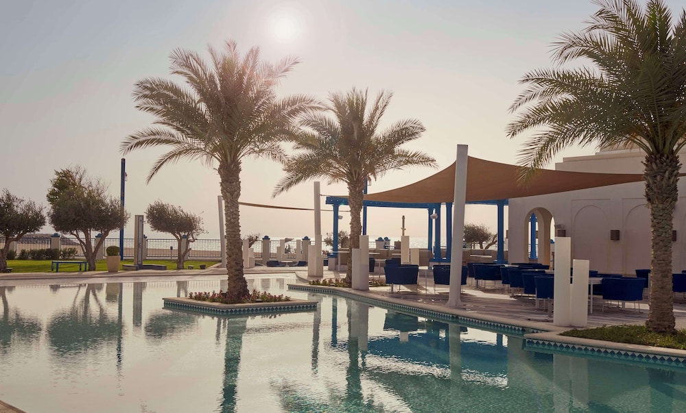 Hilton Salwa Beach Resort & Villas — Swimming pool in Abu Samra
