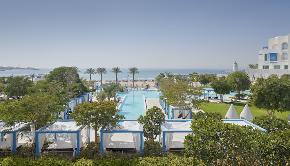 Hilton Salwa Beach Resort & Villas — Swimming pool in Abu Samra