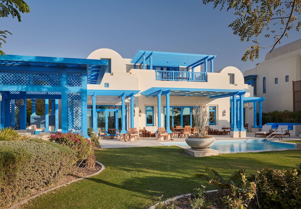 Hilton Salwa Beach Resort & Villas — Hotel building in Abu Samra