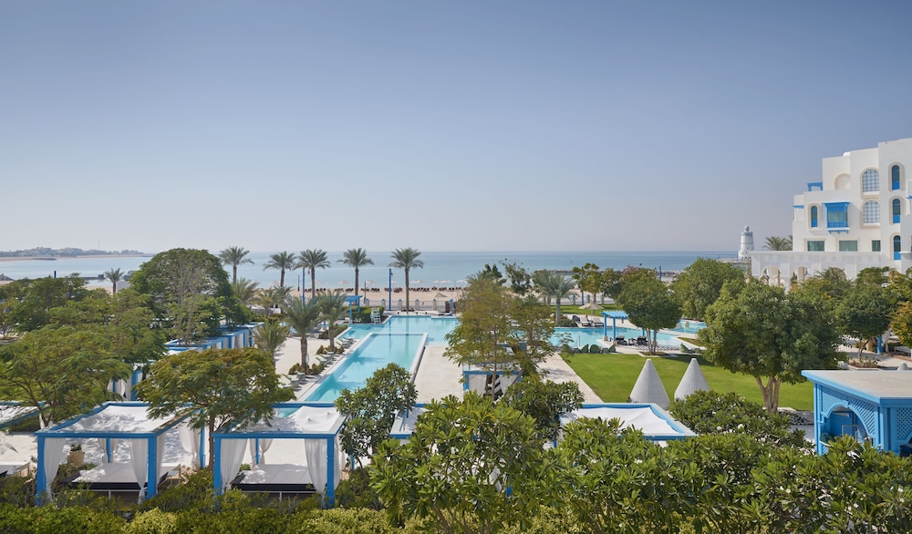 Hilton Salwa Beach Resort & Villas — Swimming pool in Abu Samra